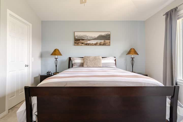 Master bedroom with queen bed and walk in closet. Attached master bathroom with 6' soaker tub and separate shower.