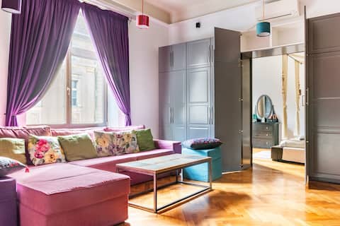 Chill in Front of the Home Theater System at a Colorful Pad
