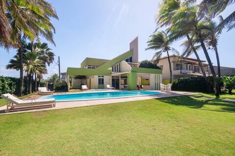 House in front of the sea , Foot in the sand