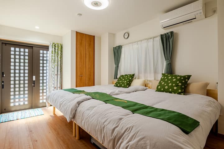 As you enter the house, you will find the first bedroom with 2 double beds.The bedroom and outside is separated by a front door and a curtain.