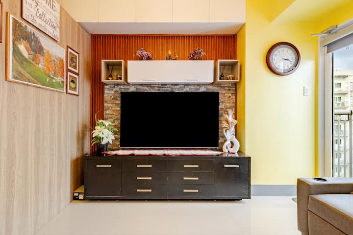 65" Google TV with apps (Netflix, Disney, HBO, Prime, YouTube etc), free TCL channels, and clear digital local channels. Split-type, inverter, Panasonic Aircon with NanoEx technology for clean & cool air. A 2-seater Sofa bed