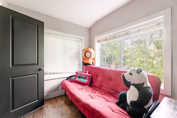 Sun room with futon off our large living room. It has closing doors for privacy.