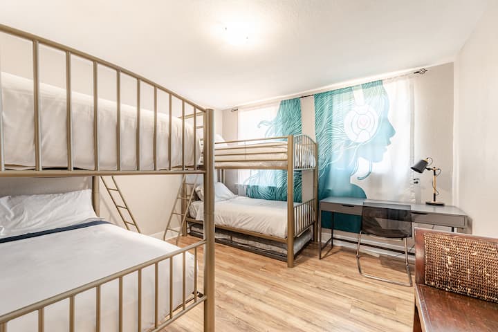 Bunk bed bedroom with 2 full size beds, 2 twins, and a hide away twin bed. 