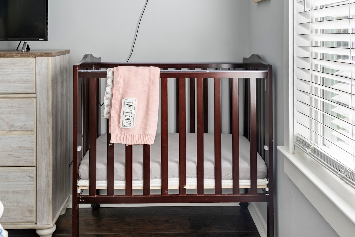 Portable crib located in The Mallard's Nest's Master Bedroom.