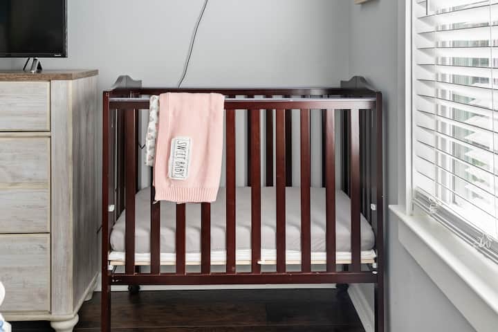 Portable crib located in The Mallard's Nest's Master Bedroom.