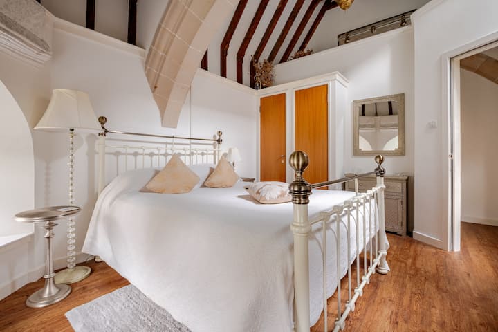 Victorian king-size bed under the high chapel ceiling