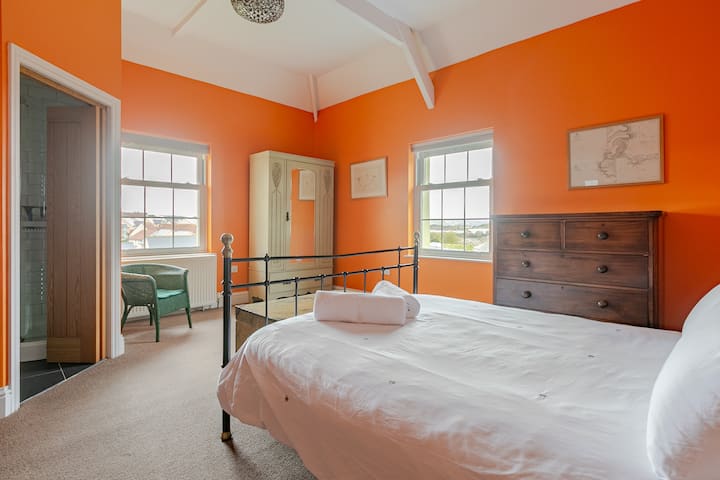 En-Suite Bedroom 1 in Spring 2024. Far reaching views across the field and estuary to the hills of St Ives and Carbis Bay