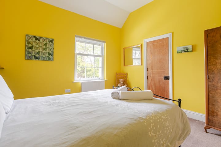 Double bed in Bedroom 4, spring 2024. Entrance from landing; this picture shows the doorway onto adjoining bedroom 5