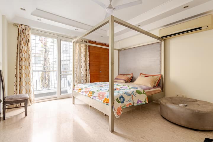Abundant Natural Light: Large windows flood the room with sunlight during the day, creating a warm and inviting atmosphere.
