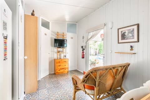 A cozy guesthouse with a pool and garden