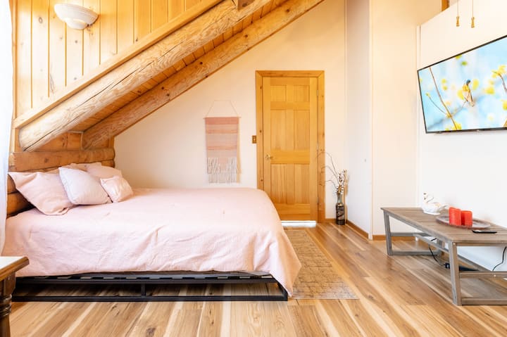 Newly Redesigned Second Floor Bedroom with Exposed Beam Ceilings featuring a Queen size bed, Queen size sofa bed, a closet and a Smart TV