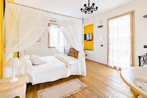 The Saffron Room in farmhouse with views and pool