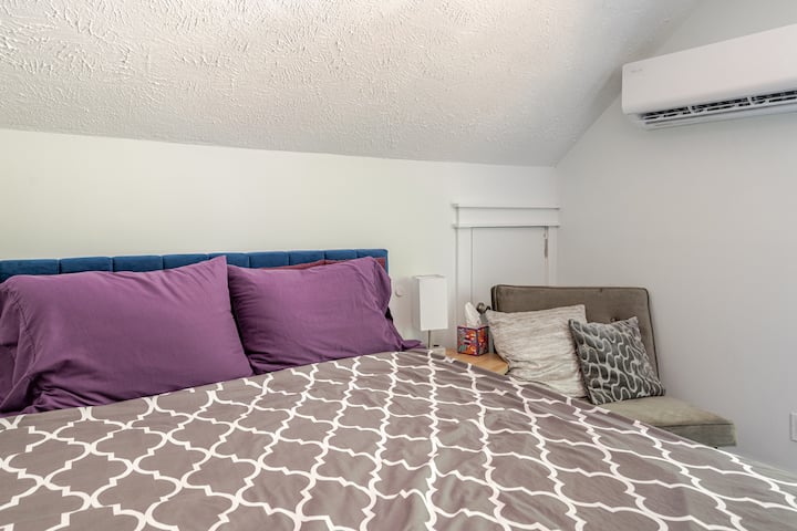 Relax in a queen bed in Grand Primary Suite with attached living room downstairs. 43" Monitor doubles as a smart screen with popular streaming services. Pivot from desk to TV easily.