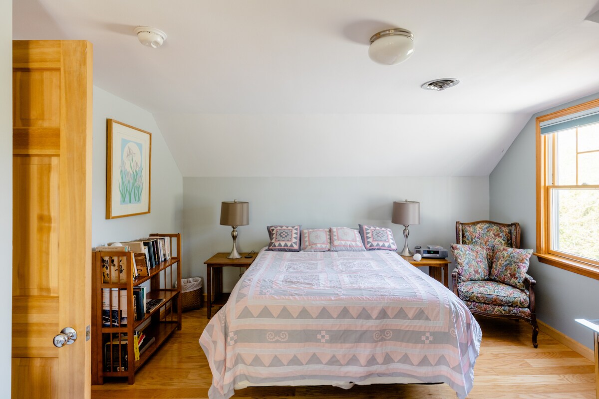 Queen bed in one of the bedrooms of the suite