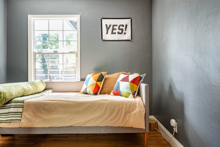The second guest room, with its twin bed, provides a snug and inviting space for younger visitors or solo travelers, with just enough room to dream big in a small space.