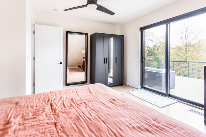 1st floor bedroom with king bed and patio door access to the balcony