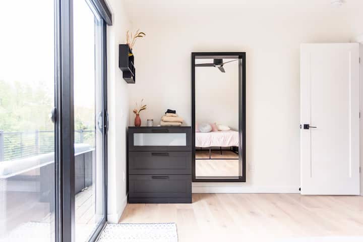 1st floor bedroom with king bed and patio door access to the balcony
