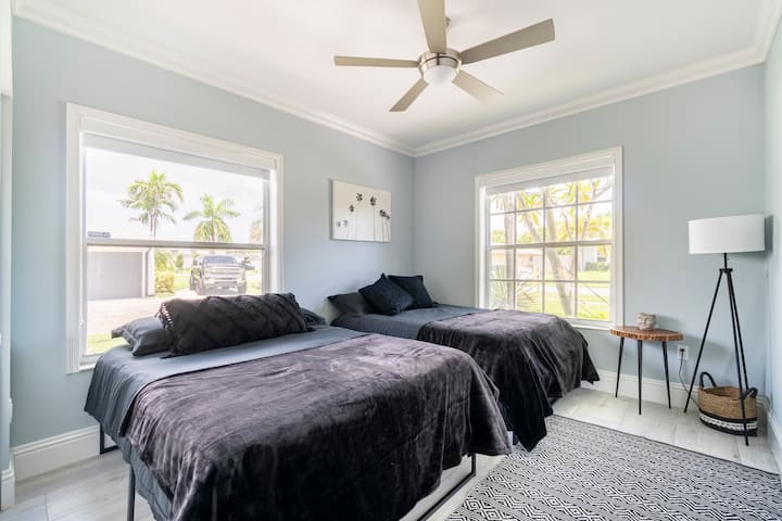 Two twin beds, windows allow for a ton of natural light but the blackout shades will help you sleep in if desired 