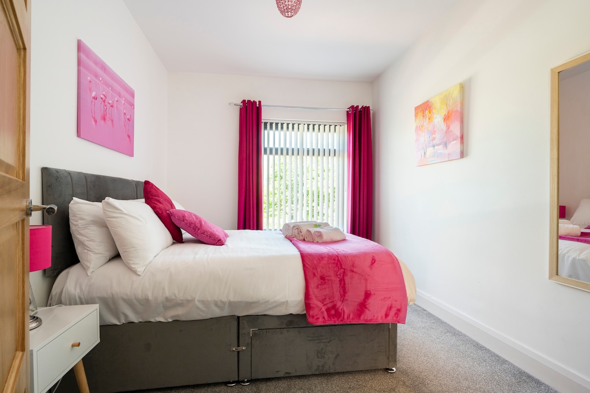 Double bedroom with views over Ormeau Park