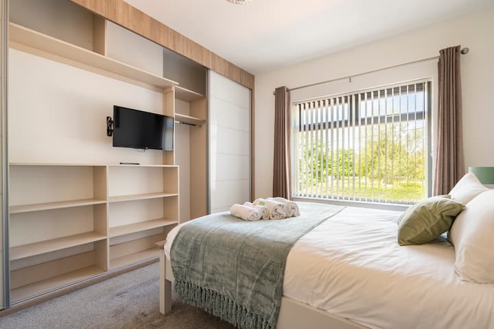 Master bedroom sliding wardrobes + TV
