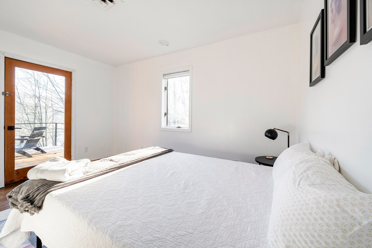 “Bowie” bedroom with queen bed and shared porch