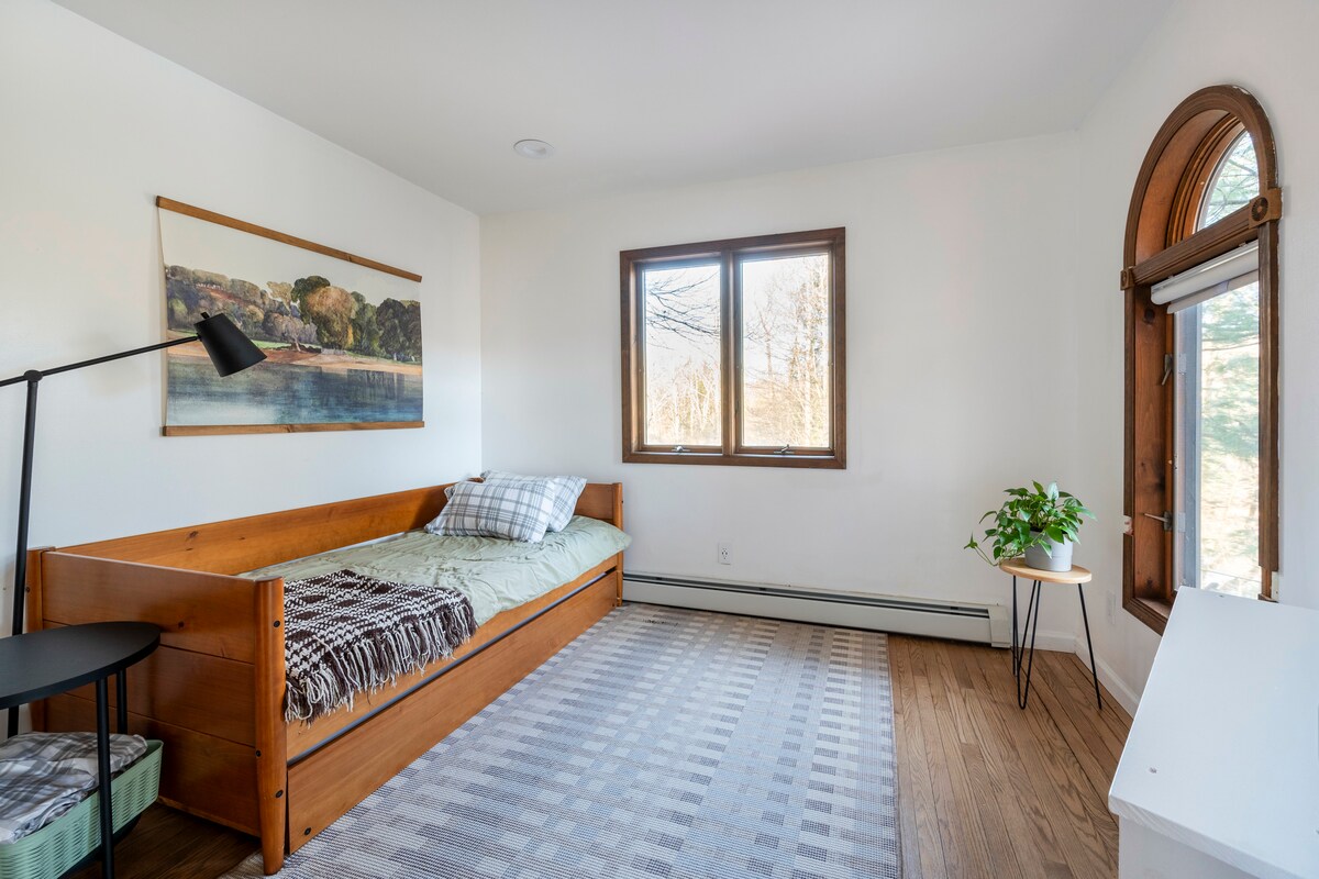First floor bedroom with a twin bed and pull out trundle bed with additional twin bed