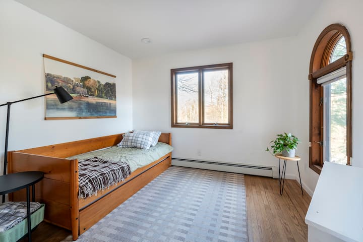 First floor bedroom with a twin bed and pull out trundle bed with additional twin bed