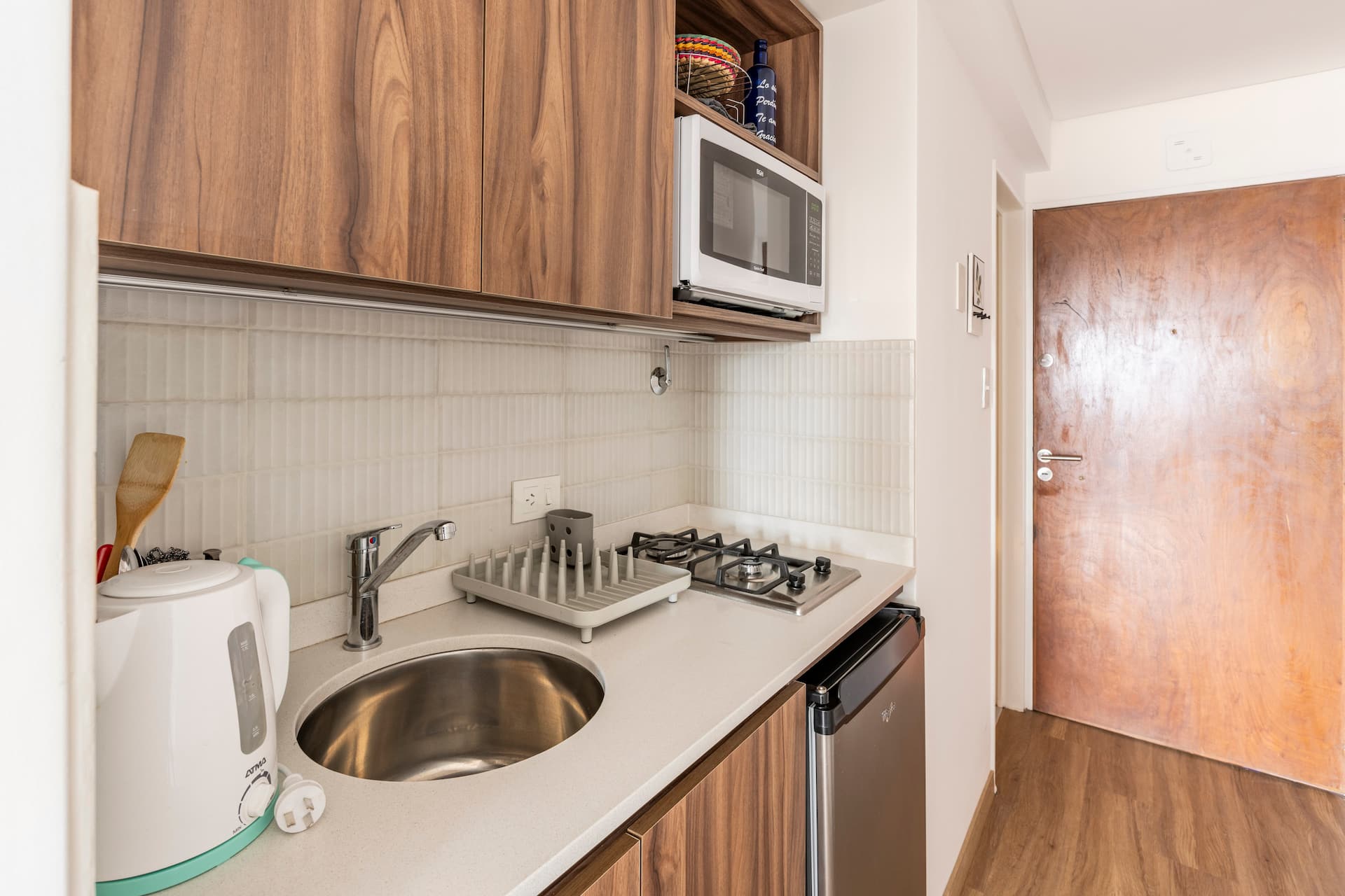 A warm studio with a city view and laundry