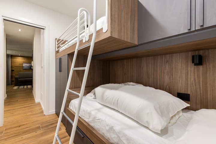 Bedroom with bunk bed and memory foam mattress. Equipped with two large closets and two spacious drawers under the bed.