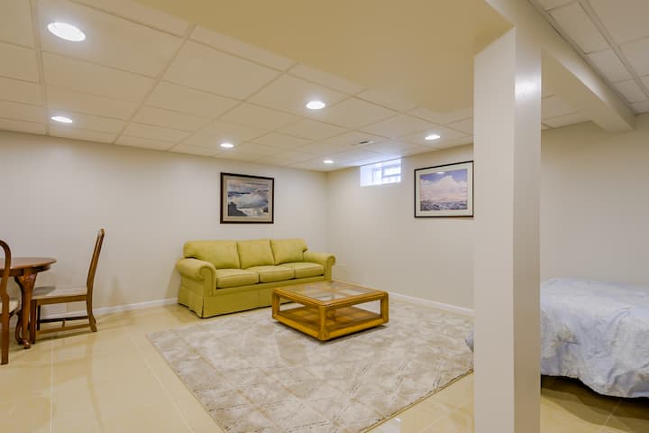 Bedroom 5 is our basement suite with a queen bed, sitting area with sofa, kitchenette 2 and eat-in dining area.