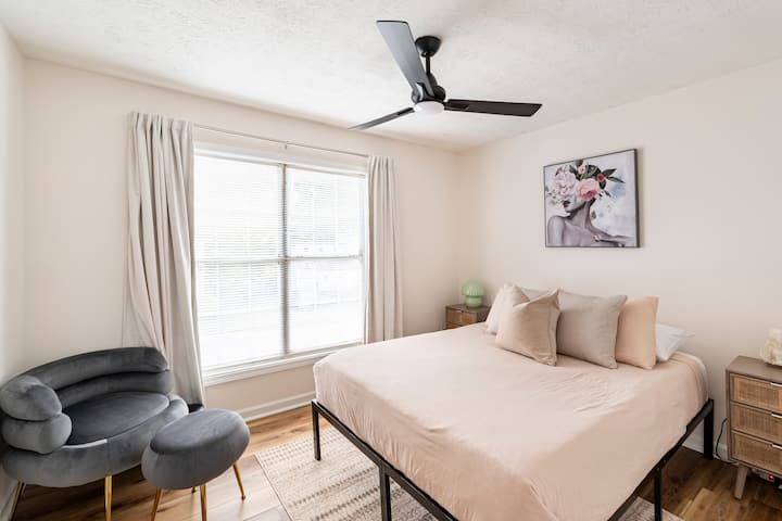 Welcome to Guest Bedroom #2, a space designed to radiate vibes and comfort. The queen bed is adorned with a memory foam gel mattress and an array of plush pillows.