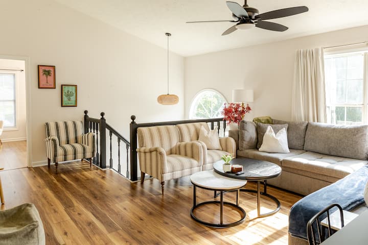 The living area #1. Sink into the huge double lounger sofa or armchairs, watch your favorite shows on the flat-screen 65 in RokuTV, or enjoy a family game from our selection of boardgames. The semi open floor plan connects the dining room and kitchen