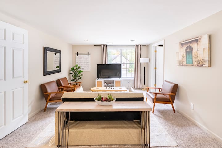 Living Room #2, your entertainment oasis featuring a smart Roku TV and comfortable seating. The double lounger sofa effortlessly transforms into a full-size bed for added convenience. Plus, relish the blackout curtains for a cozy and private vibe.