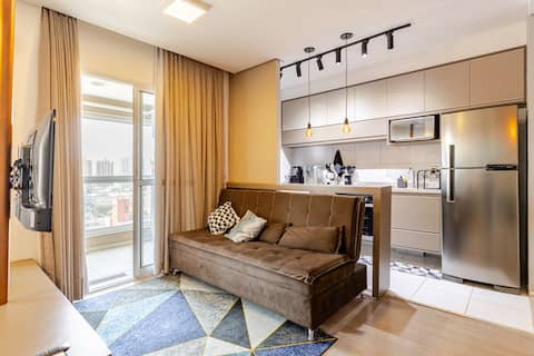 Modern studio in the center with pool and garage.