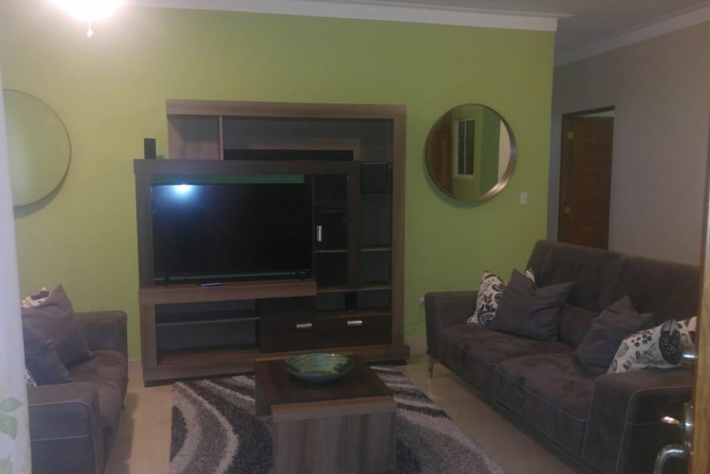 Living Room area with 55" TV, soundbar a d satellites