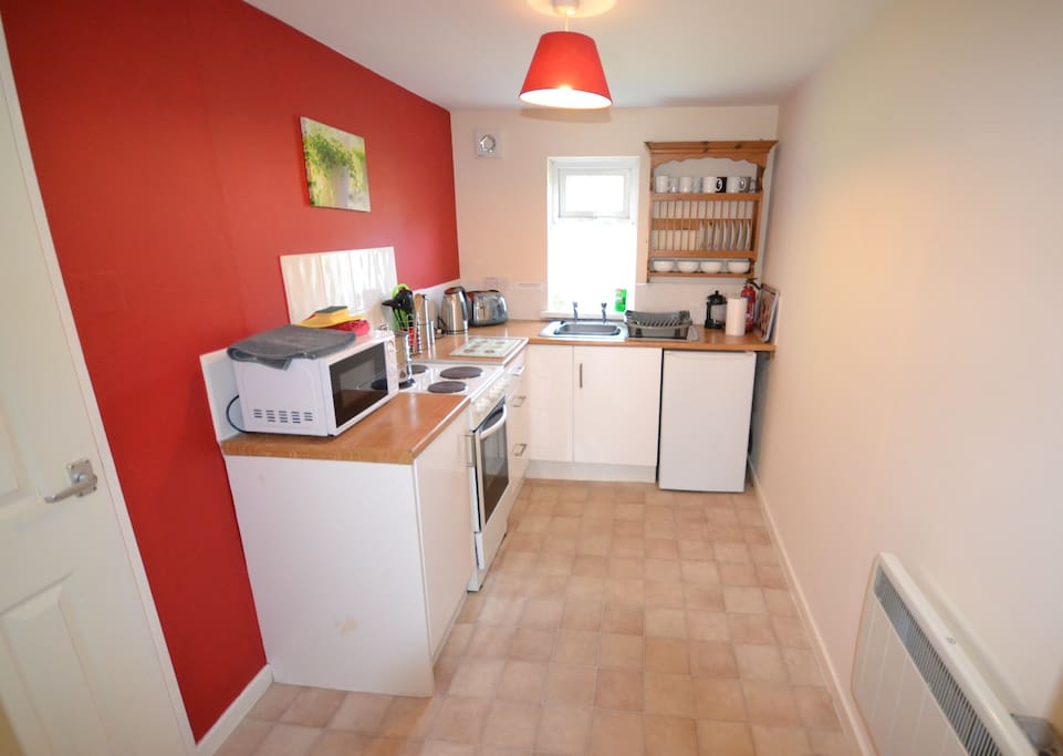 Well equipped Kitchen taken with wide angle lens