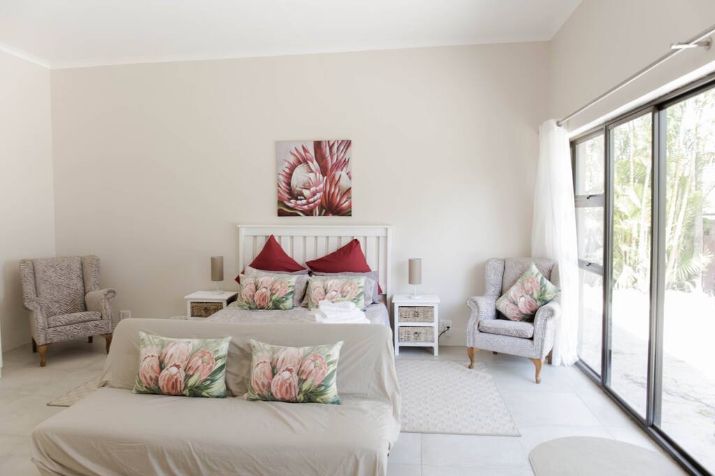 Main bed showing window and entrance to your right