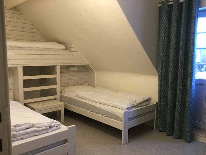 junior room with 3 separate beds