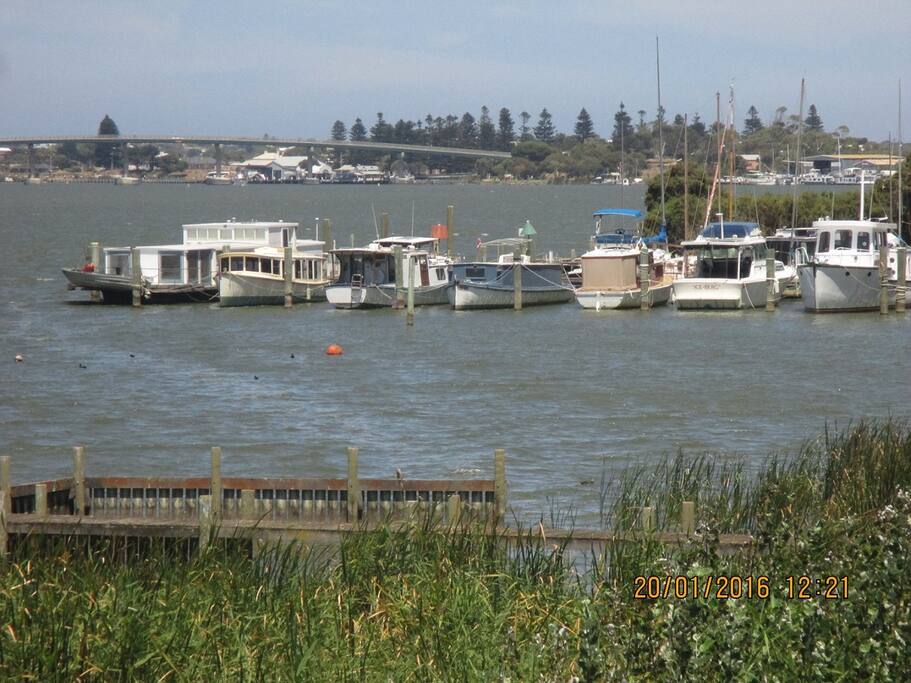 To the left of the bridge