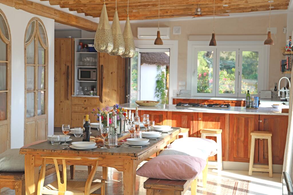 Dinner table and spacious open plan kitchen