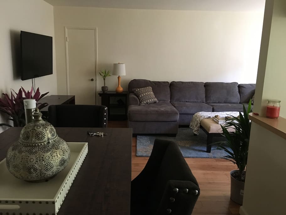 Dining room facing living room with 55 inch LED TV