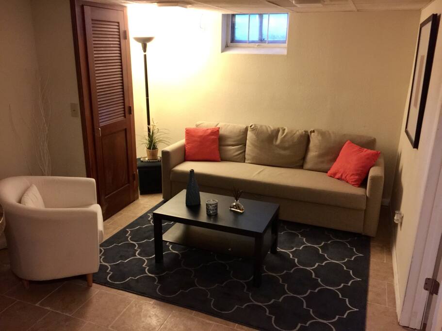 Living room with new tile and carpet.