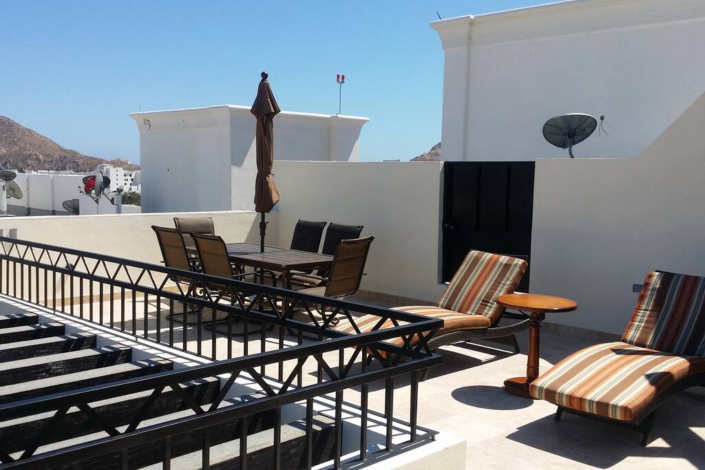 Dining and lounging on your private rooftop deck.
