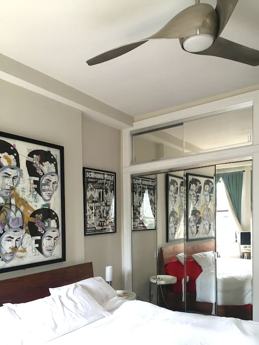 Master bedroom - mirrored closets and large ceiling fan