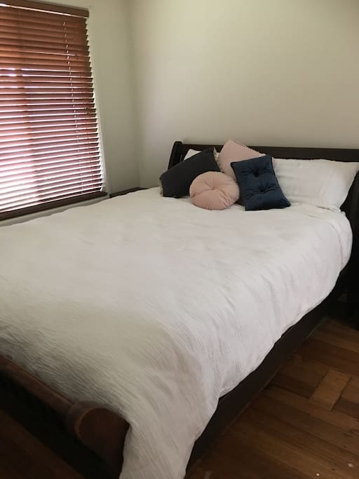 Relax in a queen master suite with luxury bedding 1000 thread count sheets and sheridan quilt.
