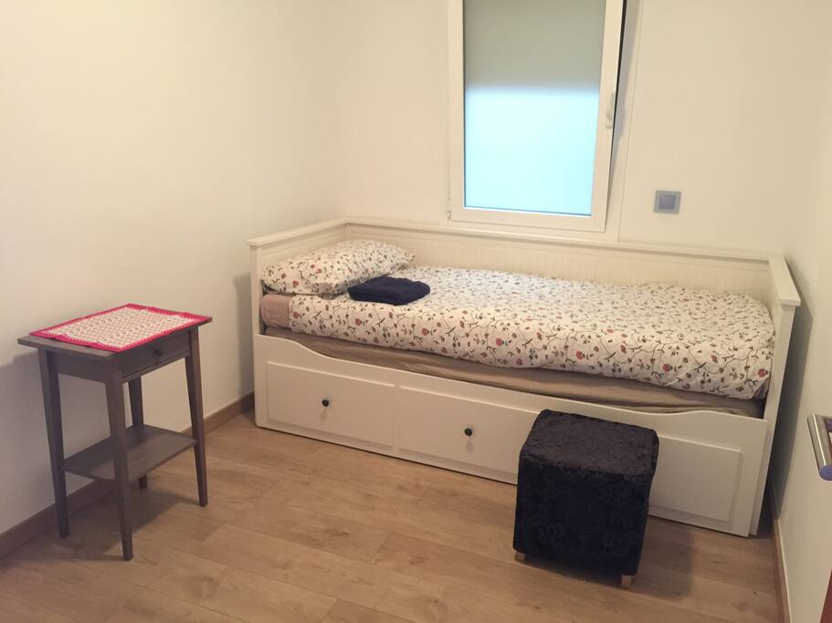 Modern 2 persons bedroom with fan in the ceiling