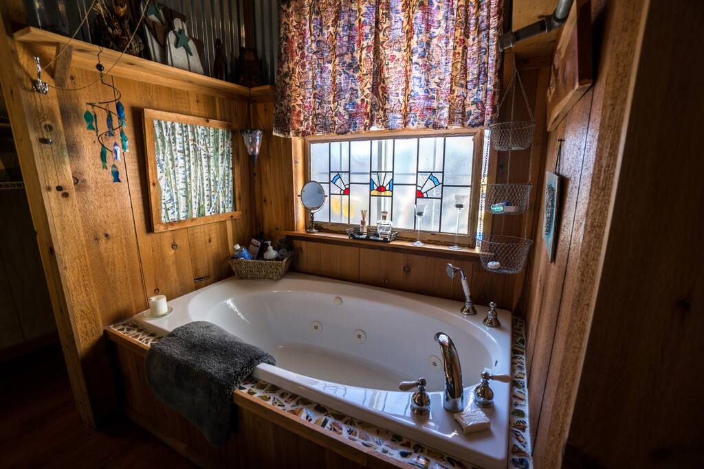 Jacuzzi tub in bathroom next to Living.