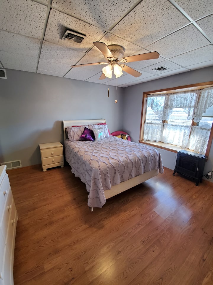 Grey bedroom,  w/ queen size bed