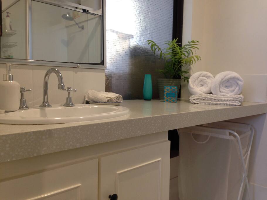 Master ensuite with WC, shower and vanity; the main bathroom has bath and shower