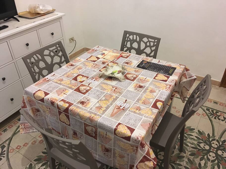 Dining room with TV and sofa